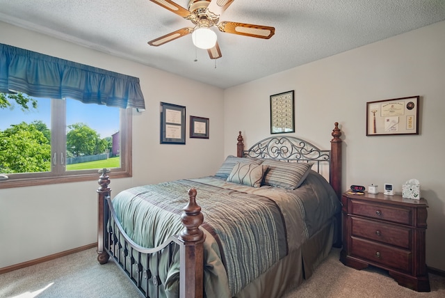 4623 62nd St, Urbandale, IA 50322 - carpeted bedroom with ceiling fan and a textured ceiling