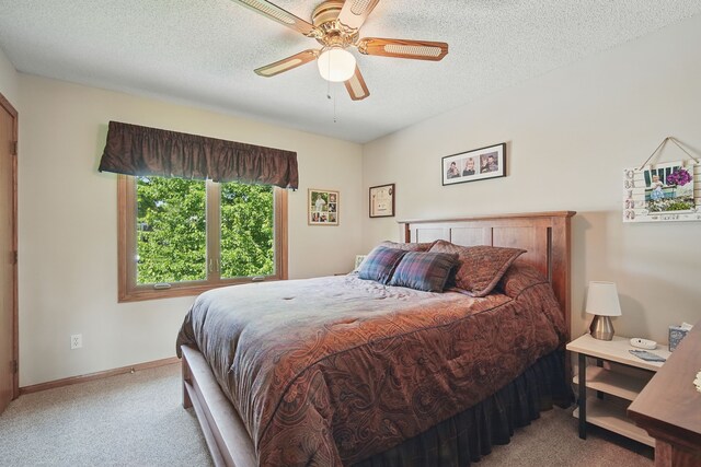 4623 62nd St, Urbandale, IA 50322 - carpeted bedroom featuring ceiling fan and a textured ceiling