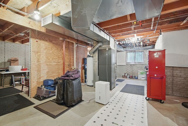 4623 62nd St, Urbandale, IA 50322 - basement with brick wall and water heater