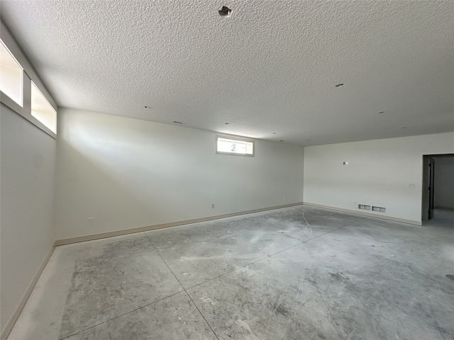 4192 NW 177th St, Clive, IA 50325 - unfurnished room with concrete flooring and a textured ceiling