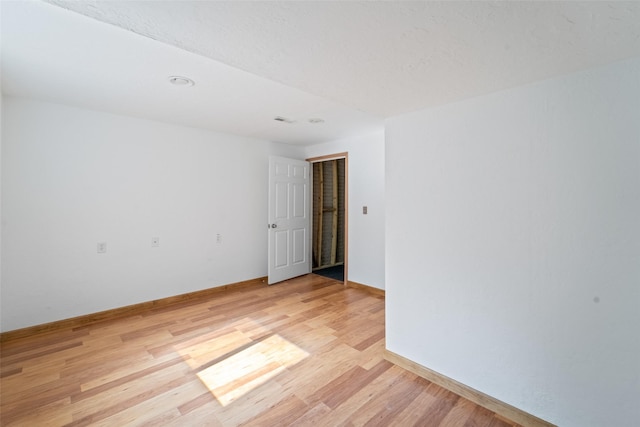 403 4th St NW, Altoona, IA 50009 - unfurnished room featuring light wood-style flooring and baseboards