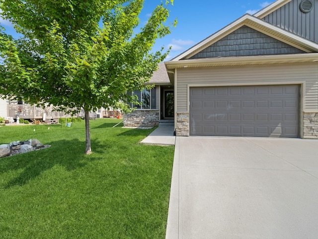 1102 NE 15th Ln, Ankeny, IA 50021 - view of front of property with stone siding, a front yard, driveway, a garage, and board and batten siding