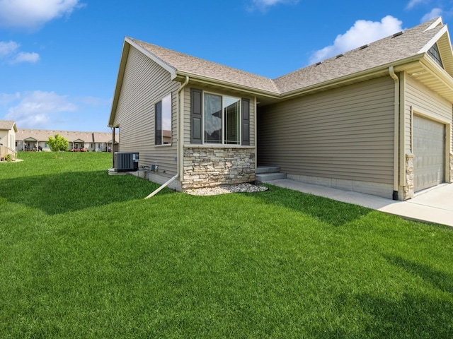 1102 NE 15th Ln, Ankeny, IA 50021 - view of front of house featuring a garage, a front lawn, a shingled roof, and concrete driveway