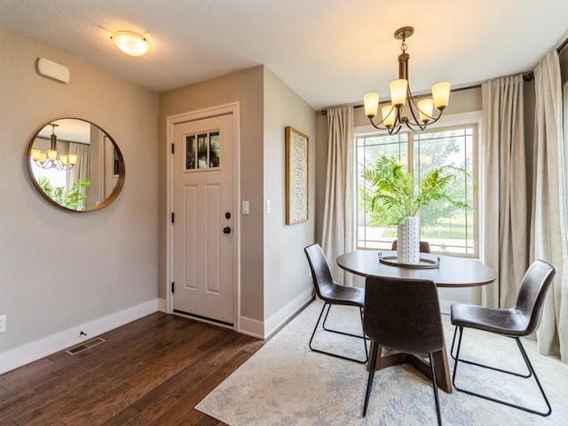 1102 NE 15th Ln, Ankeny, IA 50021 - dining space featuring a chandelier and dark wood-style flooring