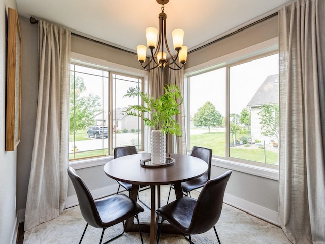 1102 NE 15th Ln, Ankeny, IA 50021 - dining room with baseboards and a chandelier