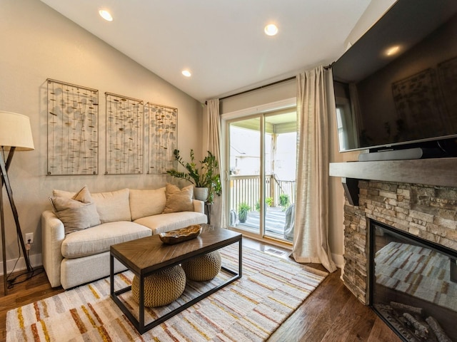 1102 NE 15th Ln, Ankeny, IA 50021 - living area with vaulted ceiling, wood finished floors, recessed lighting, and a fireplace