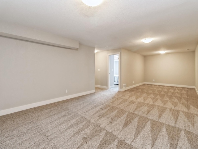1102 NE 15th Ln, Ankeny, IA 50021 - unfurnished room featuring light colored carpet and a textured ceiling
