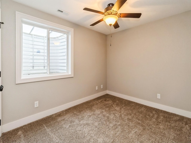 1102 NE 15th Ln, Ankeny, IA 50021 - spare room with carpet floors and a ceiling fan