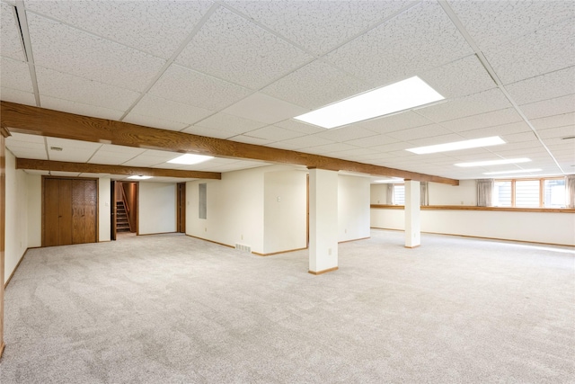 4922 Cedar Dr, West Des Moines, IA 50266 - basement with stairs, a paneled ceiling, and carpet floors