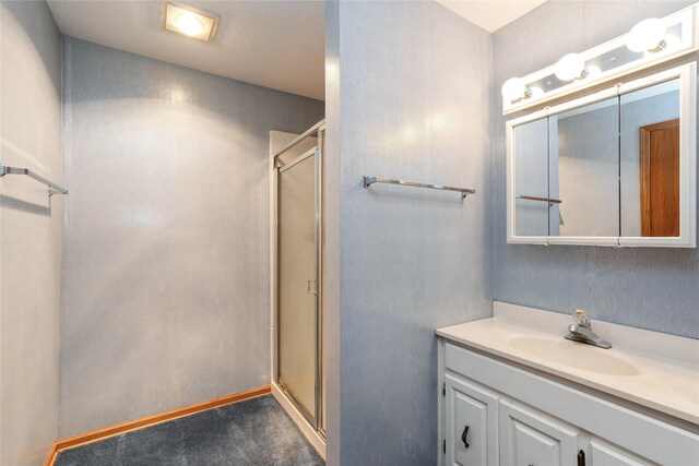 4922 Cedar Dr, West Des Moines, IA 50266 - bathroom featuring a stall shower and vanity