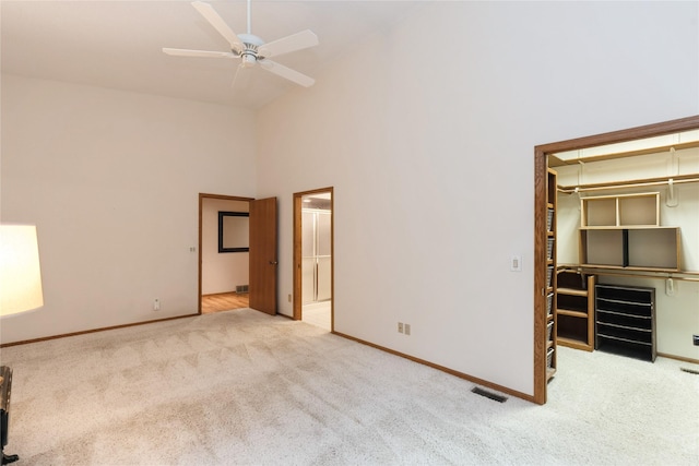 4922 Cedar Dr, West Des Moines, IA 50266 - unfurnished bedroom with high vaulted ceiling, carpet flooring, a walk in closet, ensuite bath, and a closet
