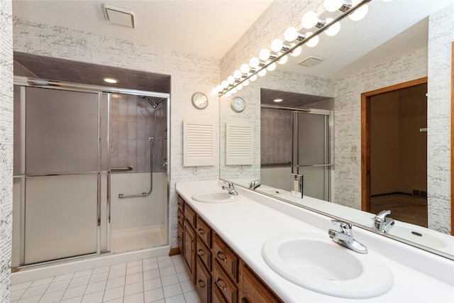 4922 Cedar Dr, West Des Moines, IA 50266 - full bathroom with tile patterned floors, double vanity, and a shower stall