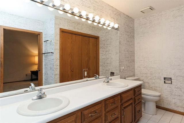 4922 Cedar Dr, West Des Moines, IA 50266 - full bath with double vanity and tile patterned flooring