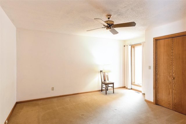 4922 Cedar Dr, West Des Moines, IA 50266 - unfurnished bedroom featuring carpet flooring, a closet, a ceiling fan, and a textured ceiling