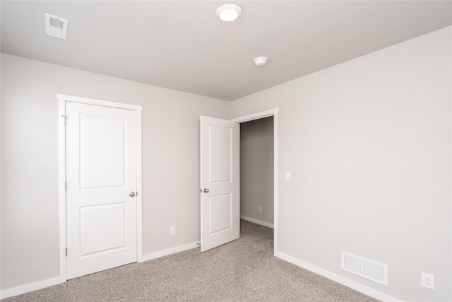 3451 10th Ave SW, Altoona, IA 50009 - unfurnished bedroom featuring light colored carpet and baseboards