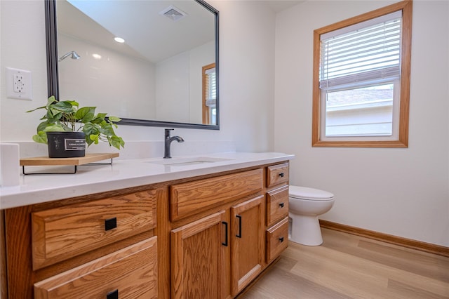 609 17th St, West Des Moines, IA 50265 - bathroom with wood finished floors and vanity