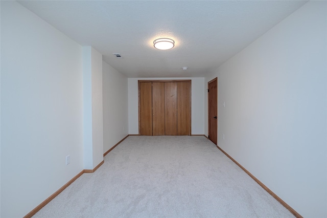 609 17th St, West Des Moines, IA 50265 - unfurnished bedroom with light carpet and a closet