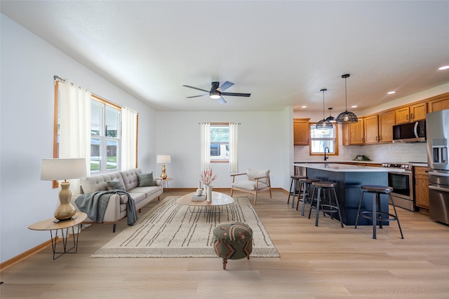 609 17th St, West Des Moines, IA 50265 - living room featuring light wood-style floors, ceiling fan, and recessed lighting