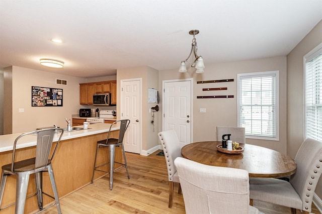 2732 Northridge Ln, Ames, IA 50010 - dining area featuring light wood-style flooring and baseboards