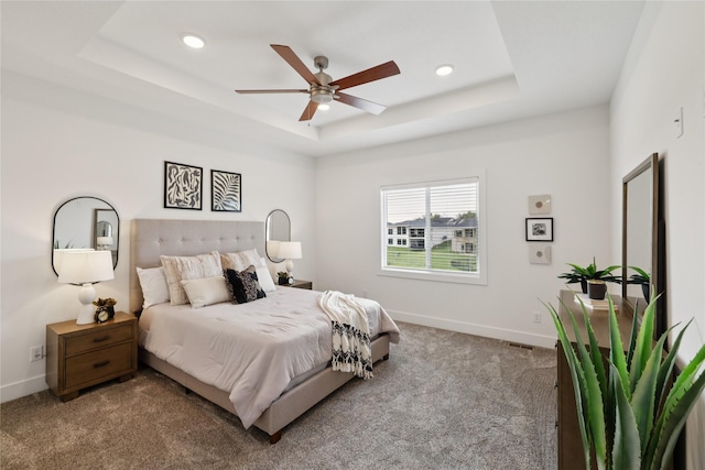 150 NW Hidden Knl, Waukee, IA 50263 - carpeted bedroom featuring a tray ceiling and recessed lighting