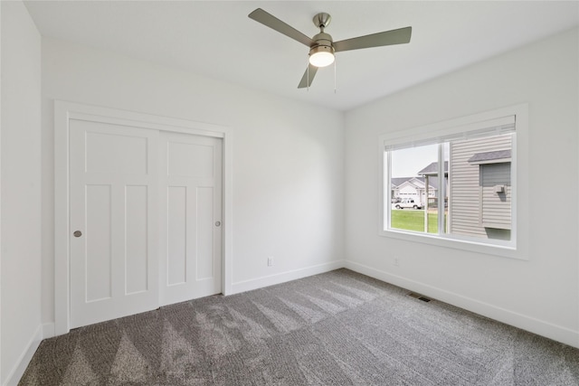 150 NW Hidden Knl, Waukee, IA 50263 - unfurnished bedroom featuring carpet flooring, a closet, and a ceiling fan