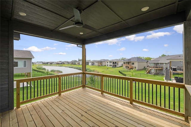 150 NW Hidden Knl, Waukee, IA 50263 - wooden terrace with a residential view, a ceiling fan, a water view, and a fenced backyard