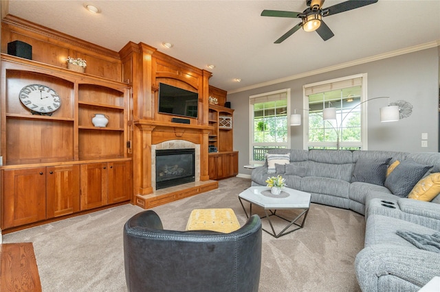 6725 NW 93rd St, Johnston, IA 50131 - living area featuring light colored carpet, ornamental molding, a ceiling fan, and a glass covered fireplace