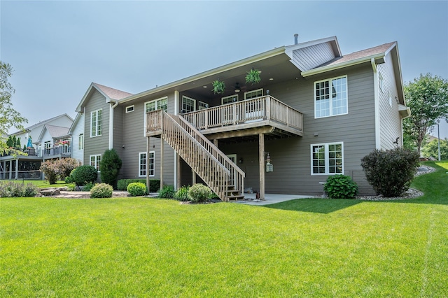 6725 NW 93rd St, Johnston, IA 50131 - rear view of house featuring ceiling fan, a wooden deck, a yard, and stairs