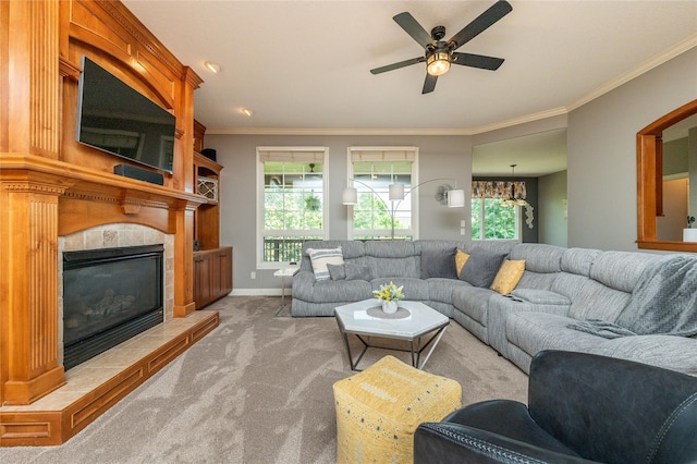 6725 NW 93rd St, Johnston, IA 50131 - living area featuring carpet, a ceiling fan, crown molding, a tiled fireplace, and a chandelier