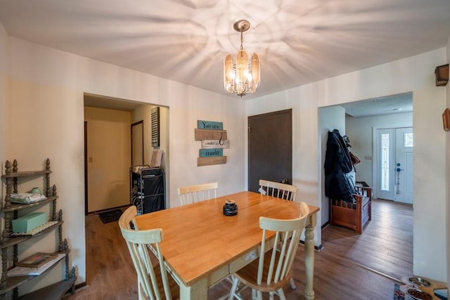 1543 S 16th Ave W, Newton, IA 50208 - dining area with a chandelier and wood finished floors