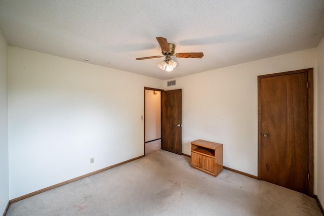1543 S 16th Ave W, Newton, IA 50208 - unfurnished bedroom featuring light colored carpet and ceiling fan