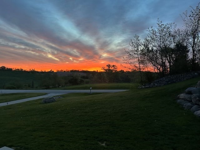 2626 SE 72nd St, Runnells, IA 50237 - yard at dusk with a lawn