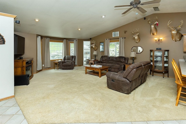 2626 SE 72nd St, Runnells, IA 50237 - living room featuring a ceiling fan, carpet floors, vaulted ceiling, tile patterned flooring, and recessed lighting