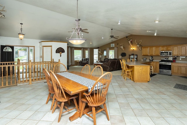 2626 SE 72nd St, Runnells, IA 50237 - dining space featuring lofted ceiling, a ceiling fan, healthy amount of natural light, and light tile patterned floors