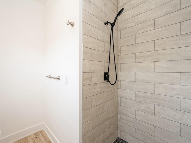 1010 Frederick Ave, Des Moines, IA 50315 - full bathroom with tiled shower and wood finished floors