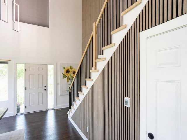 1010 Frederick Ave, Des Moines, IA 50315 - entrance foyer featuring a towering ceiling, dark wood-type flooring, and stairs