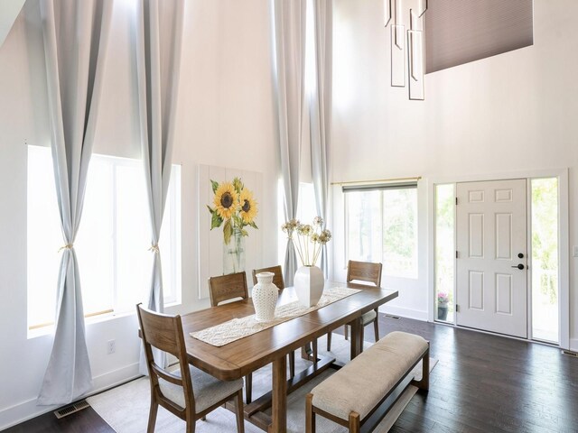 1010 Frederick Ave, Des Moines, IA 50315 - dining room with a high ceiling and wood finished floors