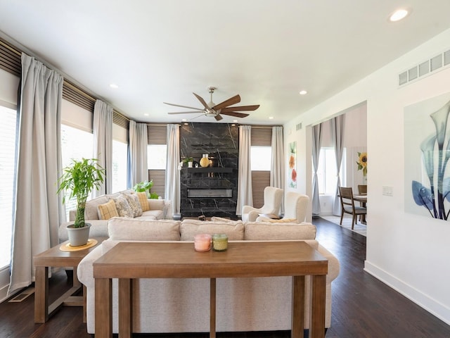 1010 Frederick Ave, Des Moines, IA 50315 - living area featuring a ceiling fan, recessed lighting, dark wood finished floors, and a premium fireplace