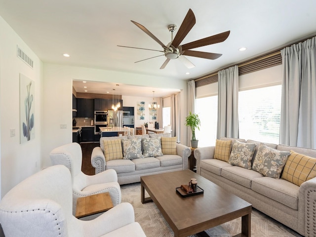 1010 Frederick Ave, Des Moines, IA 50315 - living area featuring a chandelier, a ceiling fan, and recessed lighting