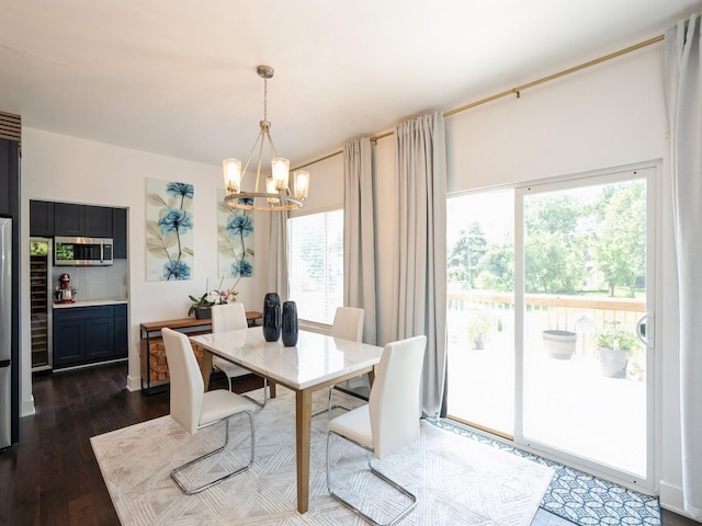 1010 Frederick Ave, Des Moines, IA 50315 - dining room with a chandelier and dark wood-type flooring