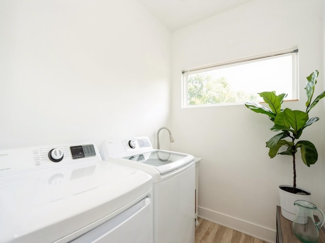 1010 Frederick Ave, Des Moines, IA 50315 - washroom featuring washer and dryer and light wood finished floors