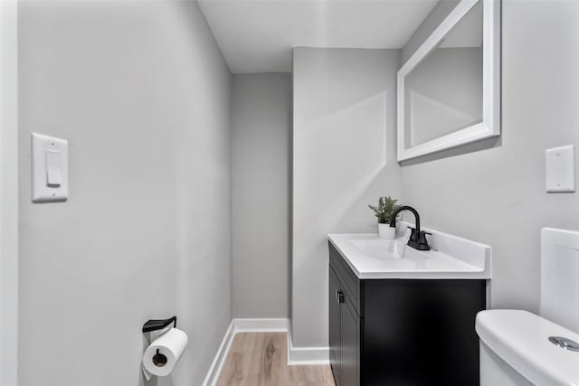 4127 E Seneca Ave, Des Moines, IA 50317 - half bath with vanity and wood finished floors