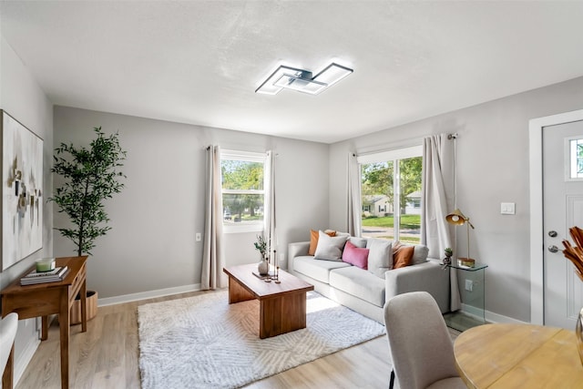4127 E Seneca Ave, Des Moines, IA 50317 - living room featuring wood finished floors and healthy amount of natural light