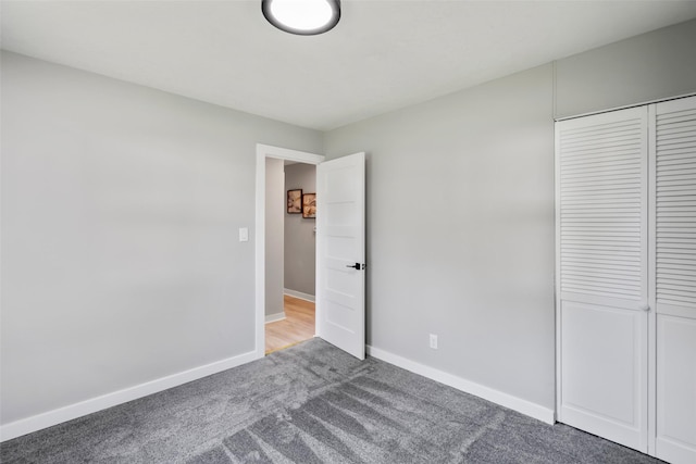 4127 E Seneca Ave, Des Moines, IA 50317 - unfurnished bedroom featuring carpet flooring and a closet