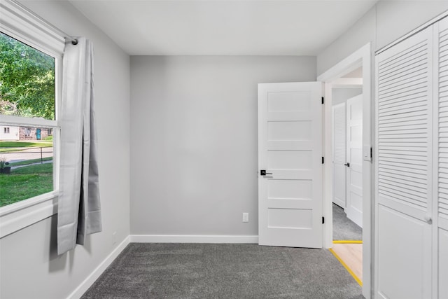 4127 E Seneca Ave, Des Moines, IA 50317 - unfurnished bedroom with carpet and a closet