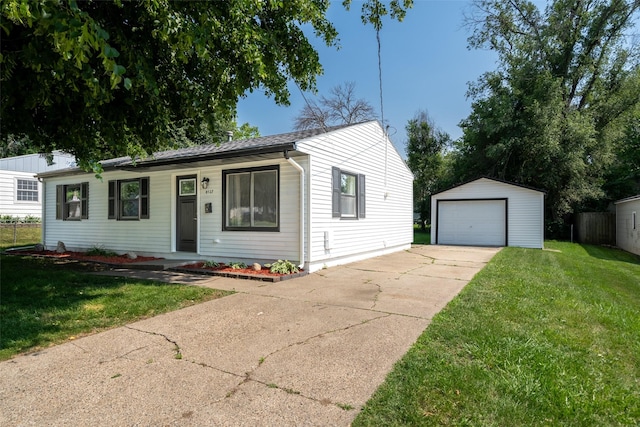 4127 E Seneca Ave, Des Moines, IA 50317 - ranch-style home featuring an outdoor structure, a detached garage, a front yard, and driveway