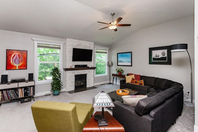 9180 Geanna Ct, West Des Moines, IA 50266 - carpeted living room featuring lofted ceiling, a ceiling fan, and a fireplace