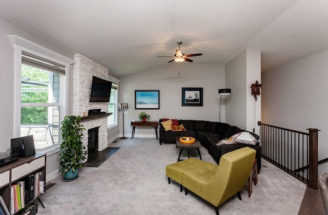 9180 Geanna Ct, West Des Moines, IA 50266 - living room featuring ceiling fan, carpet flooring, a stone fireplace, and lofted ceiling