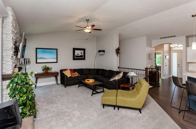 9180 Geanna Ct, West Des Moines, IA 50266 - living area featuring a ceiling fan, arched walkways, lofted ceiling, and dark wood-style flooring