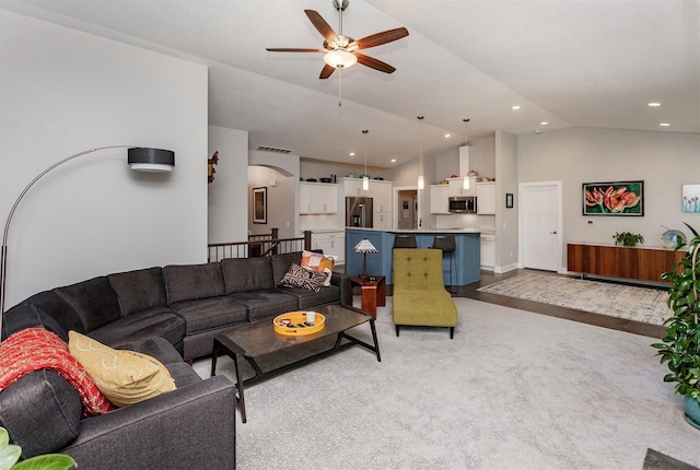 9180 Geanna Ct, West Des Moines, IA 50266 - living area featuring ceiling fan, vaulted ceiling, arched walkways, light colored carpet, and recessed lighting